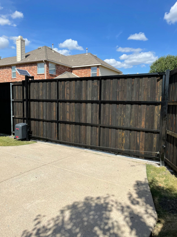 Photo for 8ft tall pre stained cedar “burnt hickory color” board on board solar powered motorized sliding gate 1