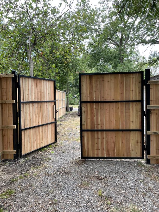 Photo for manual double gate with matching wood too blend with existing fence 1